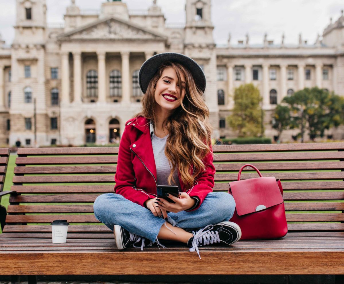 spectacular-lady-with-trendy-hairstyle-sitting-steps-front-old-historical-building (1)